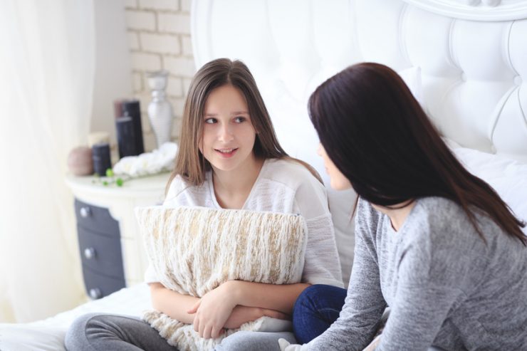 mother talking to daughter